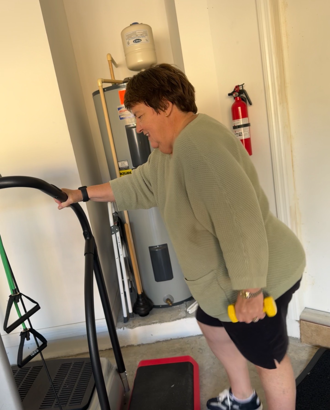 Susan training at home with dumbbells